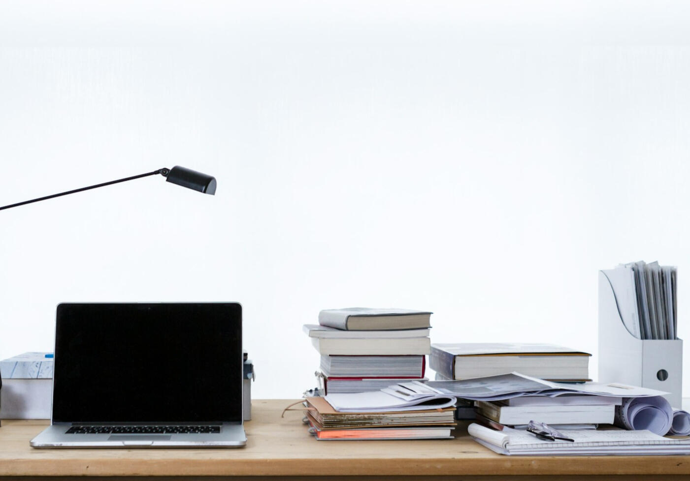 Research desk Photo of desk with computer and documents by Freddie Marriage on Unsplash